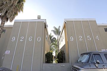 Bellflower multi-family for rent - A building with the numbers 9260 on the left side and 9254 on the right side.