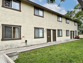 Fontana multi-family for rent - A row of houses with brown windows and doors.