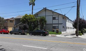 El Monte multi-family for rent - A black car is parked on the side of the road.