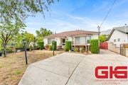 Pasadena apartment for rent - A house with a driveway and a tree in front of it.