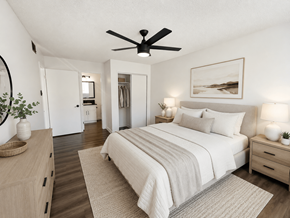 Gardena multi-family for rent - A bedroom with a large bed, a ceiling fan, and a painting on the wall.