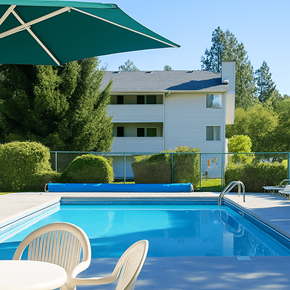 Spokane multi-family for rent - A pool with a chair and umbrella in front of a house.