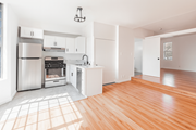 Tujunga multi-family for rent - A kitchen with wooden floors and white walls.