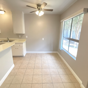 Lynwood multi-family for rent - A kitchen with a fan and a window.