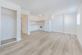 Wilmington multi-family for rent - A kitchen area with a refrigerator, sink, and cabinets.