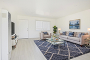 Sun Valley multi-family for rent - A living room with a couch, chair, and coffee table.