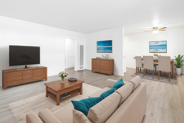 Azusa multi-family for rent - A living room with a brown couch and a wooden coffee table.