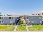 Rialto multi-family for rent - Apartment complex with a staircase leading to the entrance.