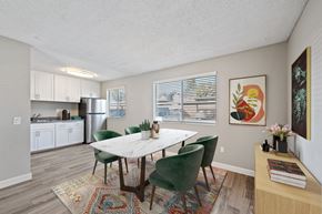 Moreno Valley apartment for rent - A dining room with a table and chairs.