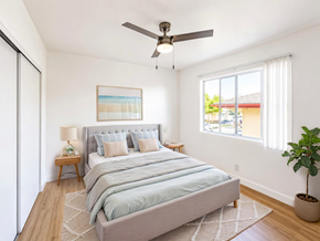 San Gabriel apartment for rent - A bedroom with a large bed and a ceiling fan.