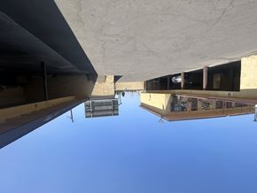 Compton multi-family for rent - A clear blue sky is visible through the openings of a concrete structure.
