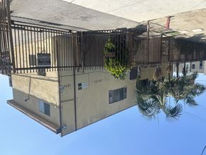 Compton multi-family for rent - A building with a sign that says