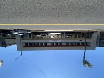 Gardena multi-family for rent - A building with a yellow line on the ground.