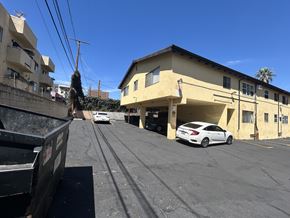 Los Angeles apartment for rent - A white car is parked in a parking lot.