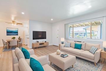 El Monte apartment for rent - A living room with a white couch and a television.