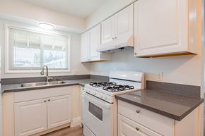 El Monte apartment for rent - A white kitchen with a stove and sink.
