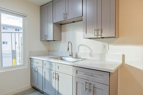 Bellflower multi-family for rent - A kitchen with a sink and cabinets.