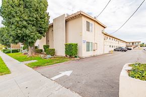 Bellflower multi-family for rent - A building with a sign that says "Blue" on it.