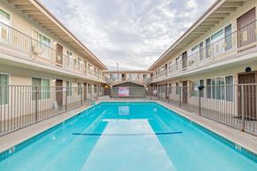 Bellflower multi-family for rent - A large indoor swimming pool in a residential building.