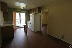 Ontario apartment for rent - A kitchen with a refrigerator and a counter.