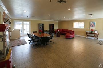 Ontario apartment for rent - A living room with a dining table and chairs.