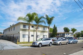 Los Angeles multi-family for rent - A row of houses with cars parked in front.