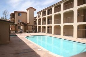 El Centro apartment for rent - A large swimming pool in front of a building with a balcony.