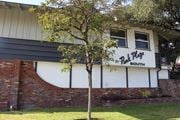Temple City multi-family for rent - A tree in front of a building with a sign that says "Pit Plug South".