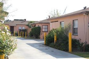 El Monte multi-family for rent - A row of houses with a sidewalk in front.