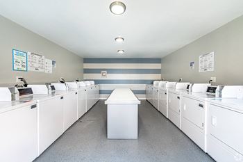 The laundry room is equipped with washers and dryers