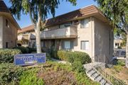 Montebello multi-family for rent - a building with a blue sign in front of it at North View Terrace, California, 90640