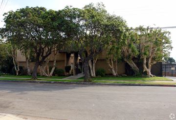 Inglewood multi-family for rent - A tree-lined street in front of a building.