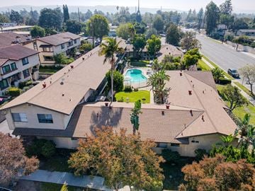 Covina multi-family for rent - A residential area with houses and a pool.