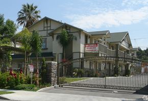 Lake Elsinore multi-family for rent - A gated community with a sign that says "New Home Open House".