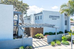 Lompoc multi-family for rent - A white building with a sign that says "Fresh Apartments".