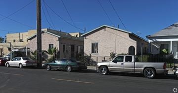 Los Angeles apartment for rent - A silver truck is parked in front of a house.