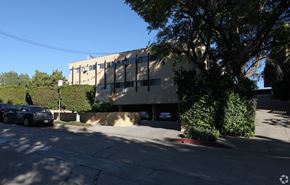 Los Feliz multi-family for rent - A car is parked on the left side of the street.
