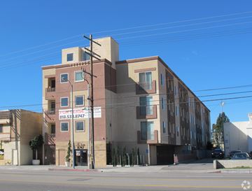 Los Angeles multi-family for rent - A building with a sign that reads "818.53.8747" is shown.