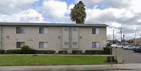 Pico Rivera multi-family for rent - A building with a palm tree in front of it.
