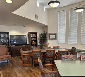 Commerce multi-family for rent - A room with a green table and chairs.