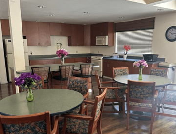 Commerce multi-family for rent - A kitchen with a table and chairs.
