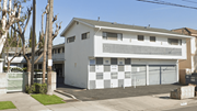 Commerce apartment for rent - A white two-story house with a garage door and a driveway.