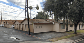 Pomona multi-family for rent - A row of houses with a tree in front of the last one.
