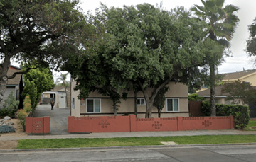 Azusa apartment for rent - A row of houses with a red fence in front.