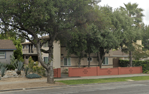 Azusa apartment for rent - A tree in front of a house with a red fence.