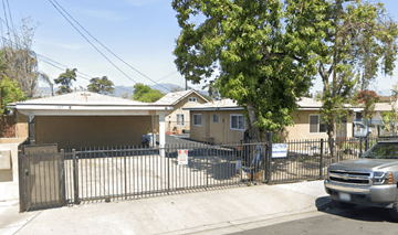 El Monte multi-family for rent - A house with a black gate and a silver truck parked in front.