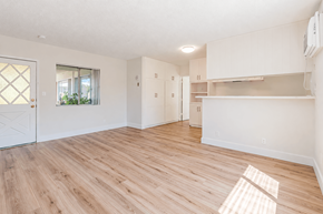 El Monte multi-family for rent - A room with wooden flooring and white walls.