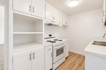 El Monte multi-family for rent - A white kitchen with a stove and sink.