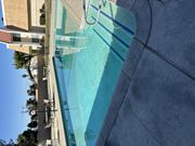 Hemet multi-family for rent - A swimming pool with a blue tinted water.