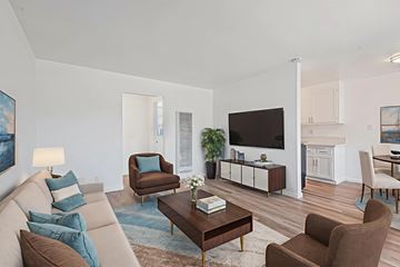 Norwalk apartment for rent - A living room with a brown chair and a brown sofa.
